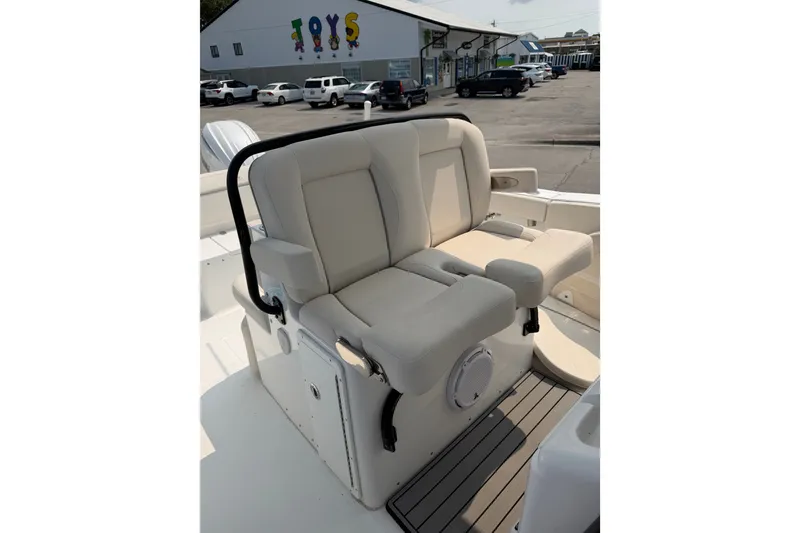 Slide: The Image of 2024 Sea Hunt Ultra 275 SE boat seating with beige upholstery and armrests. - 35