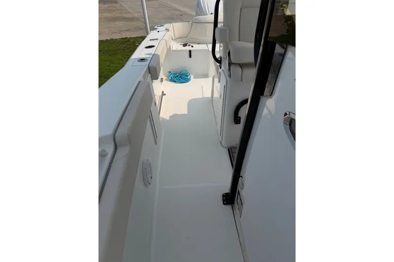 Slide: The Image of 2024 Sea Hunt Ultra 275 SE boat interior with seating and storage. - 32