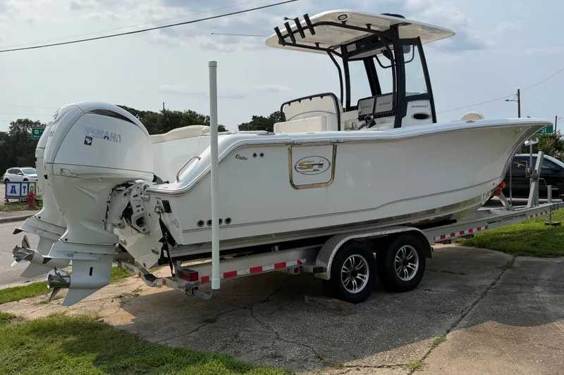 Slide: The Image of 2024 Sea Hunt Ultra 275 SE boat on trailer with Yamaha engines. - 2