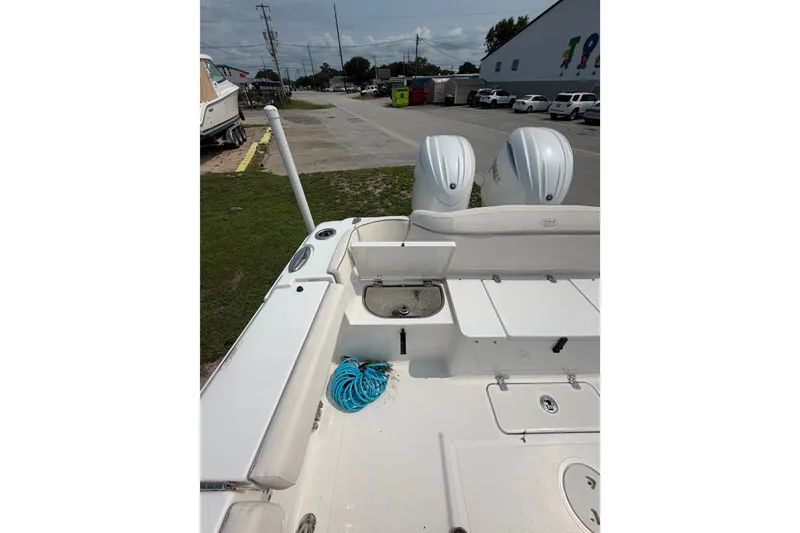 Slide: The Image of 2024 Sea Hunt Ultra 275 SE boat with dual engines and spacious deck layout. - 47