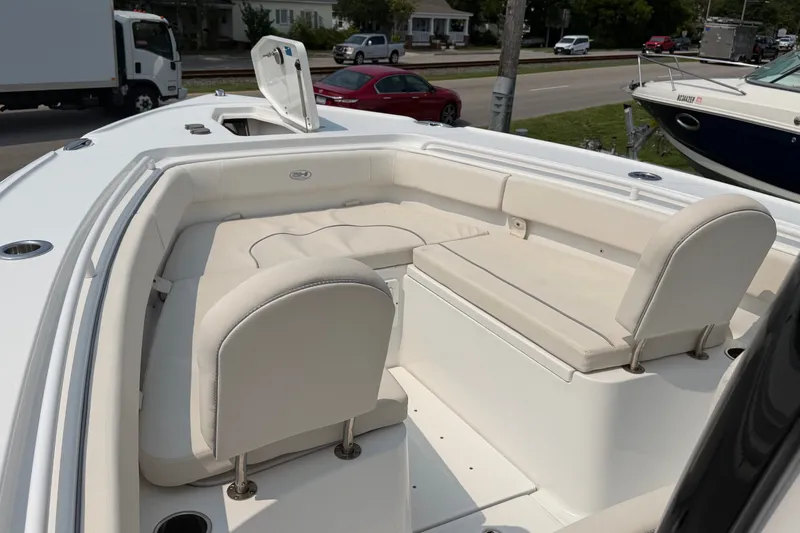 Slide: The Image of 2024 Sea Hunt Ultra 275 SE boat with spacious seating and sleek design. - 26
