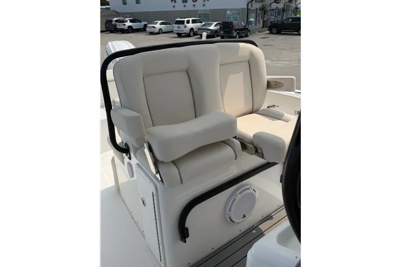 Slide: The Image of 2024 Sea Hunt Ultra 275 SE boat seating with cushioned backrest and armrests. - 23