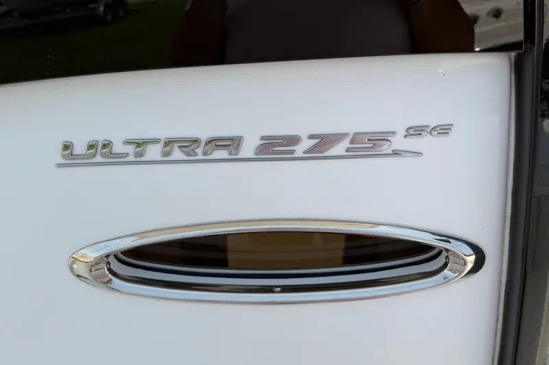 Slide: The Image of 2024 Sea Hunt Ultra 275 SE boat emblem on white surface. - 33