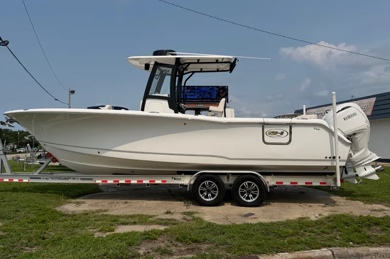 The Image of 2024 Sea Hunt Ultra 275 SE boat on trailer, side view, outdoors. - 0