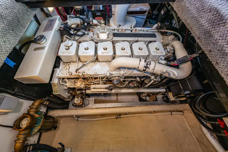 Slide: The Image of Engine compartment of a 2000 Nordic Tug 32, showcasing detailed mechanical components. - 35