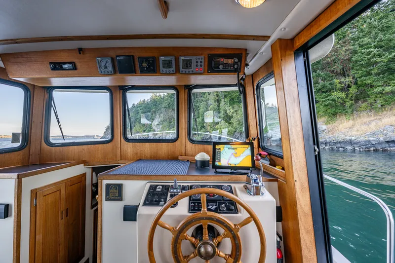Slide: The Image of Interior view of a 2000 Nordic Tug 32 boat cockpit with navigation equipment. - 29