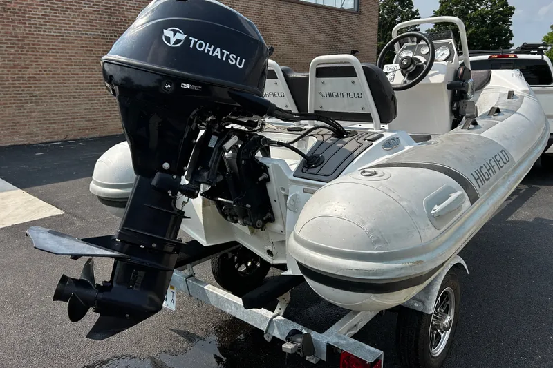 Slide: The Image of 2021 Highfield Sport 330 inflatable boat with Tohatsu outboard motor on trailer. - 6