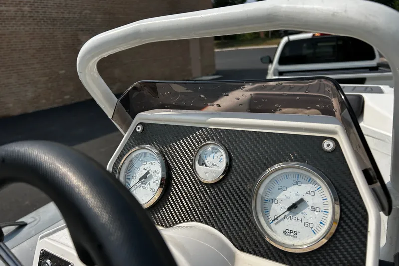 Slide: The Image of Dashboard of a 2021 Highfield Sport 330 boat with speed and fuel gauges. - 8