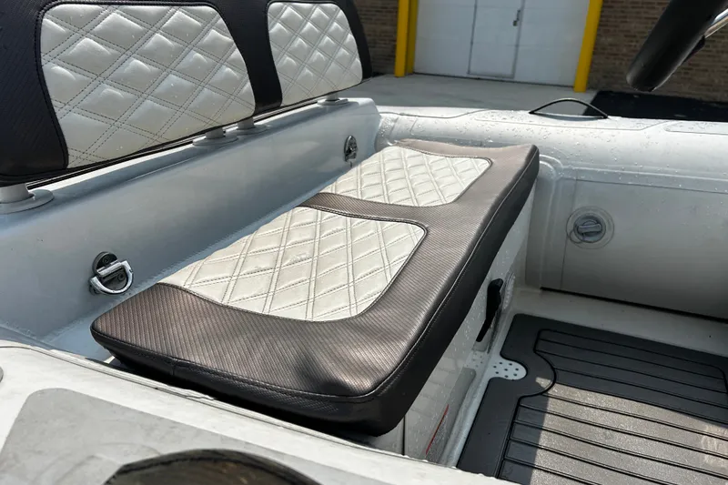Slide: The Image of 2021 Highfield Sport 330 boat interior with diamond-stitched seating and sleek design. - 10