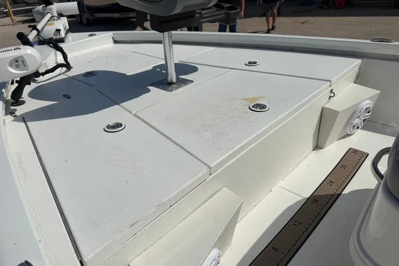 Slide: The Image of 2021 Avid 19 FS boat deck with storage compartments and mounted equipment. - 10