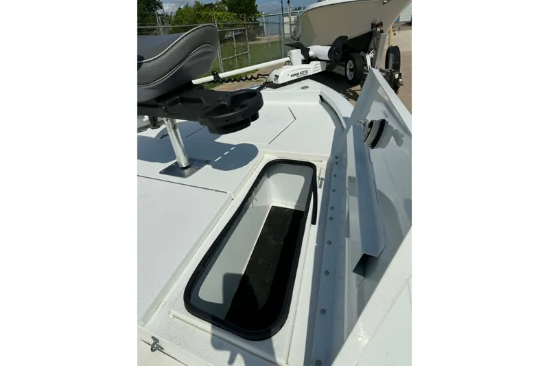 Slide: The Image of 2021 Avid 19 FS boat deck with storage compartment and seating. - 10