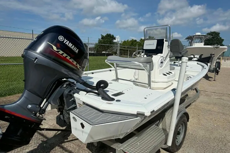 Slide: The Image of 2021 Avid 19 FS boat with Yamaha motor and Garmin navigation system on trailer. - 5