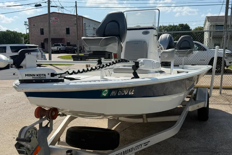 Slide: The Image of 2021 Avid 19 FS boat on trailer with Minn Kota PowerDrive motor. - 4