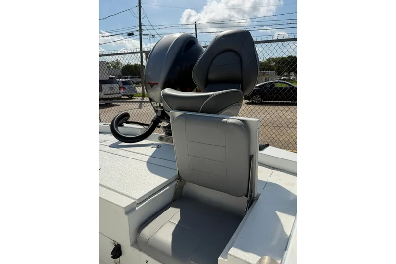 Slide: The Image of 2021 Avid 19 FS boat with gray seating and powerful outboard motor. - 9