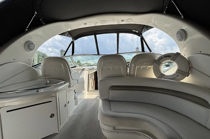 Slide: The Image of Interior of a 2006 Sea Ray 340 Sundancer boat with plush seating and modern design. - 8