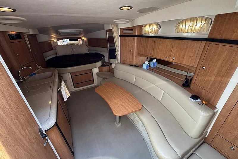 Slide: The Image of Luxurious interior of a 2006 Sea Ray 340 Sundancer yacht with wood cabinetry and seating. - 20