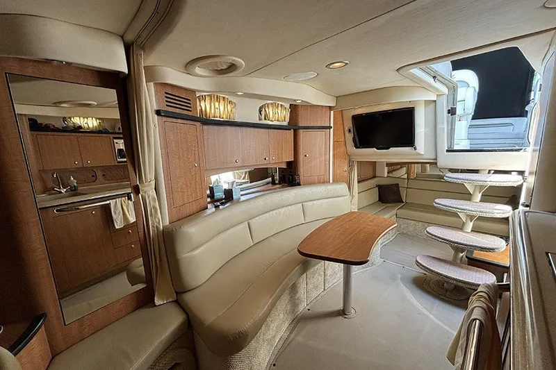 Slide: The Image of Luxurious interior of a 2006 Sea Ray 340 Sundancer yacht with elegant seating and modern amenities. - 28