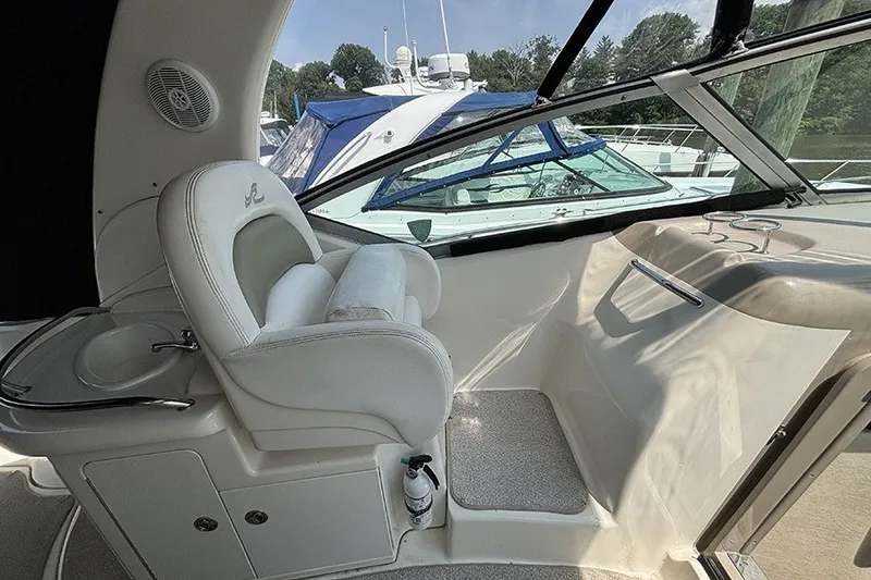 Slide: The Image of Interior of 2006 Sea Ray 340 Sundancer boat with helm seat and dashboard view. - 16