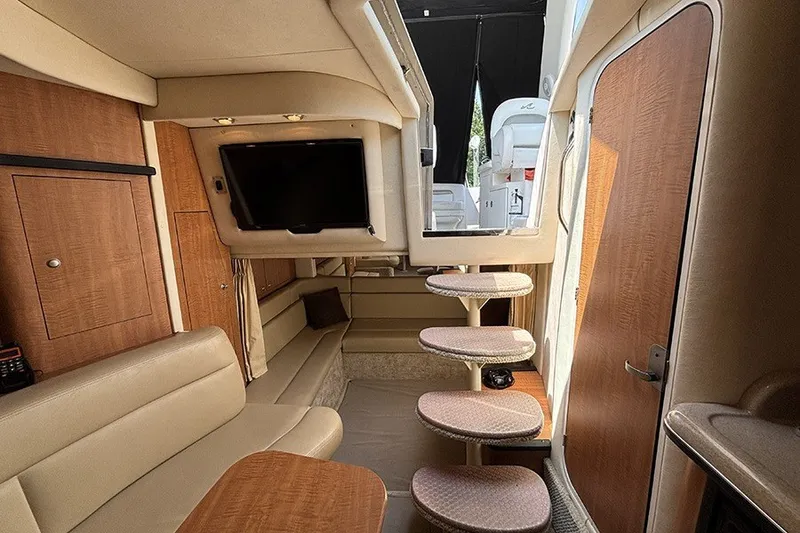 Slide: The Image of Interior of 2006 Sea Ray 340 Sundancer yacht with seating, TV, and stairs. - 31