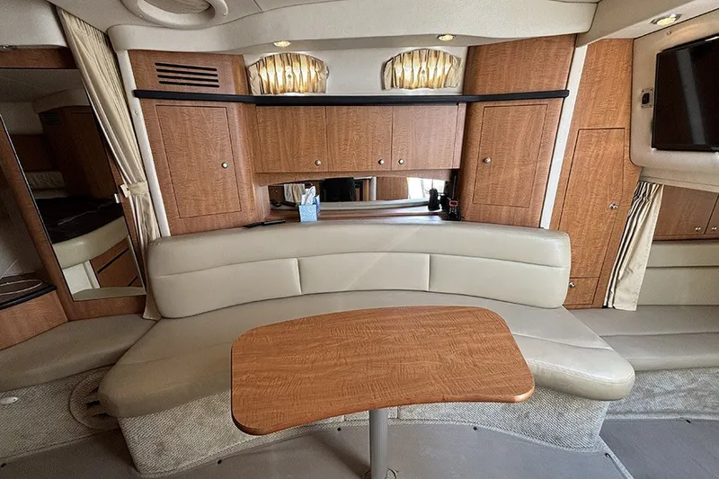 Slide: The Image of Luxurious interior of a 2006 Sea Ray 340 Sundancer yacht with elegant seating and wood finishes. - 29