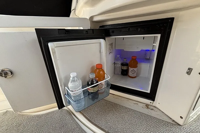 Slide: The Image of Mini fridge on 2006 Sea Ray 340 Sundancer yacht, stocked with beverages. - 11