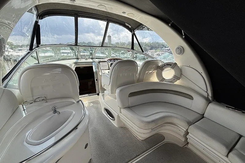 Slide: The Image of Interior of 2006 Sea Ray 340 Sundancer yacht with plush seating and helm. - 5