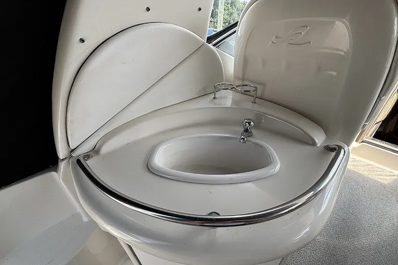 Slide: The Image of 2006 Sea Ray 340 Sundancer boat sink with chrome accents and integrated cup holder. - 10