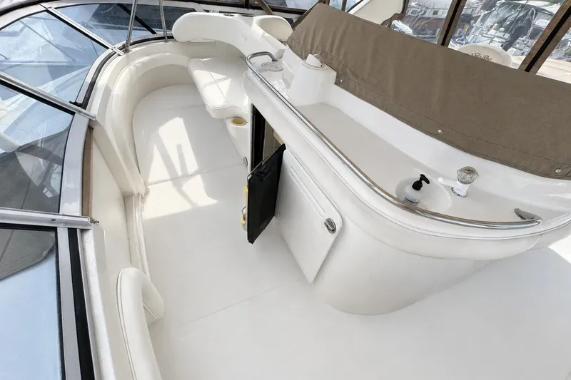 Slide: The Image of 2001 Sea Ray 450 Express Bridge interior with seating and helm station. - 13