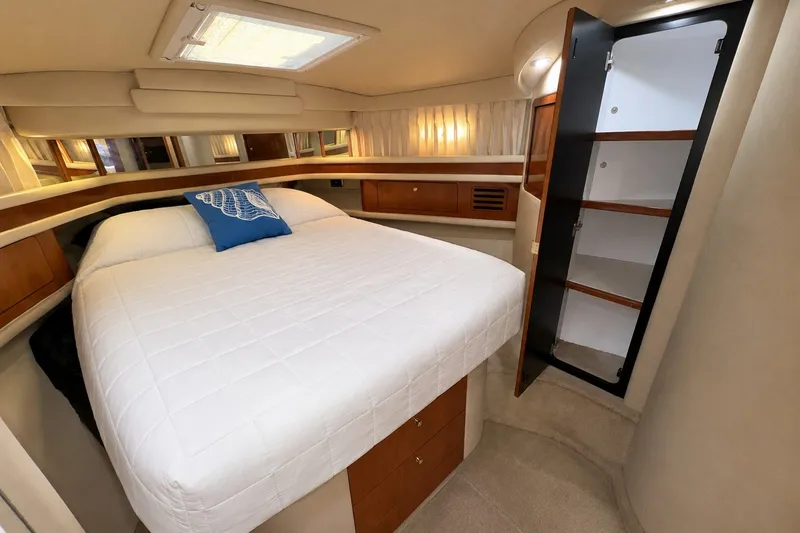 Slide: The Image of Luxurious bedroom interior of 2001 Sea Ray 450 Express Bridge yacht. - 24