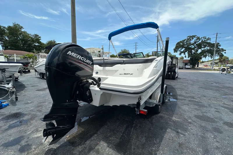 Slide: The Image of 2016 Sea Ray SPX 210 Outboard boat with Mercury engine on trailer. - 2