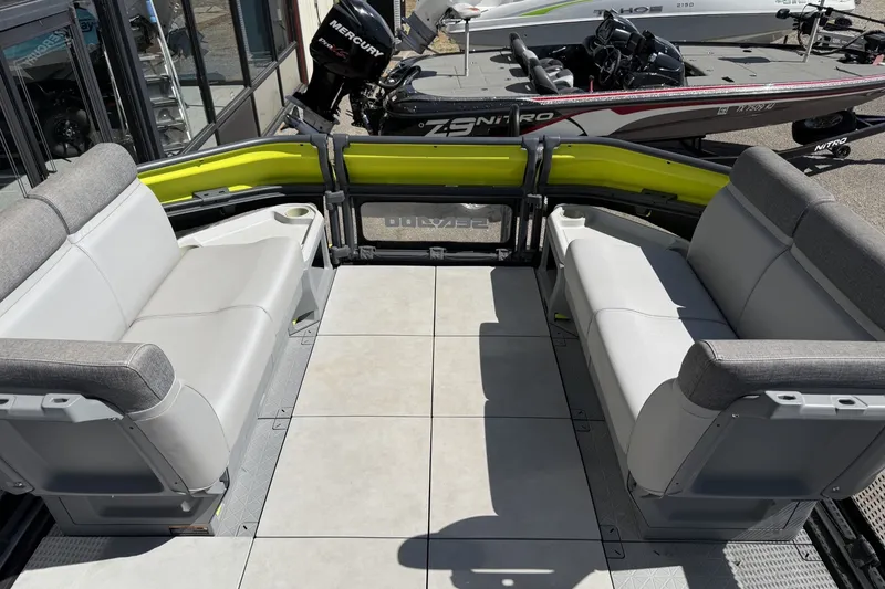 Slide: The Image of 2024 Sea-Doo Switch Cruise 21 interior with gray seating and spacious deck layout. - 4