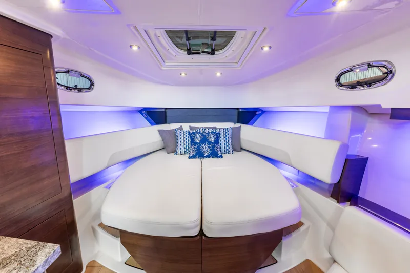 Slide: The Image of Luxurious interior cabin of 2018 Boston Whaler 345 Conquest with elegant seating and ambient lighting. - 45