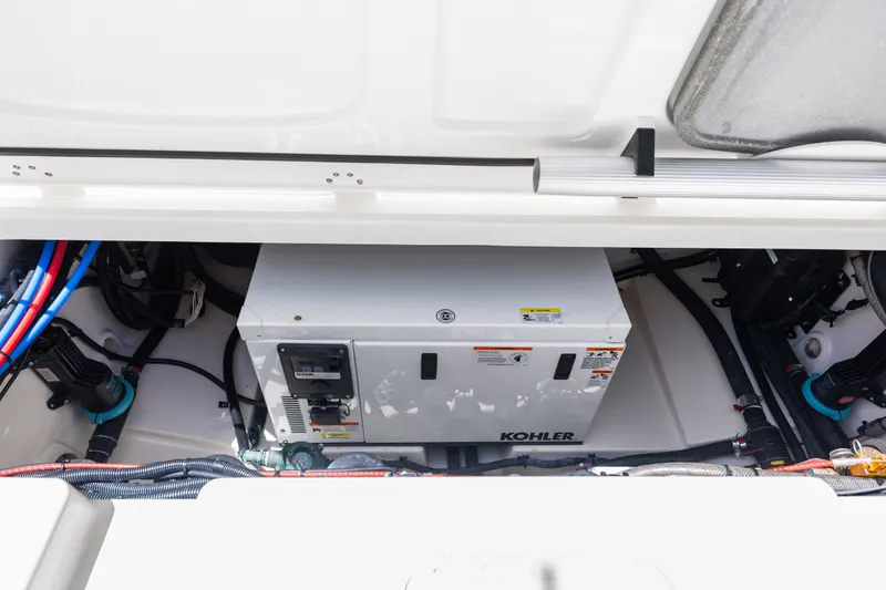 Slide: The Image of Engine compartment of 2018 Boston Whaler 345 Conquest with Kohler generator. - 29
