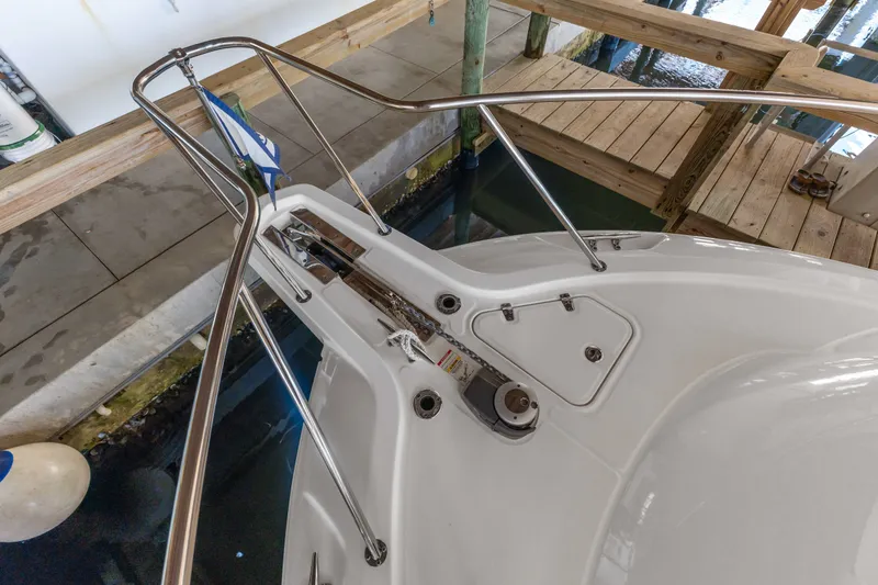 Slide: The Image of Bow view of 2018 Boston Whaler 345 Conquest docked, showcasing anchor system and railing. - 48