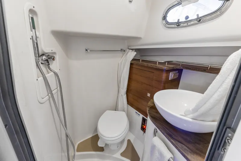 Slide: The Image of Luxurious bathroom in 2018 Boston Whaler 345 Conquest boat, featuring modern fixtures and elegant design. - 41