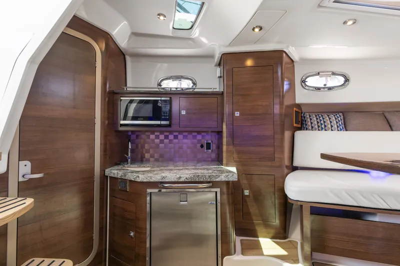 Slide: The Image of Luxurious interior of 2018 Boston Whaler 345 Conquest with modern kitchen and seating area. - 35