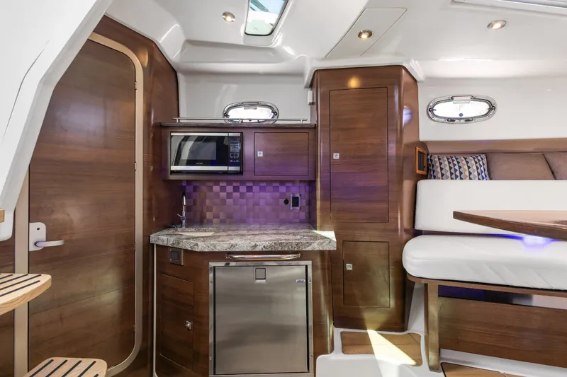 Slide: The Image of Luxurious interior of 2018 Boston Whaler 345 Conquest boat with modern kitchen amenities. - 36