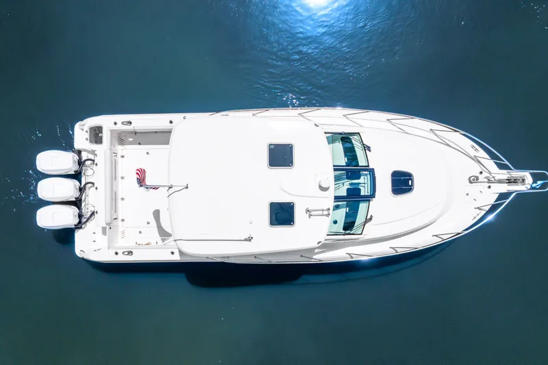 Slide: The Image of Overhead view of 2018 Boston Whaler 345 Conquest boat on water. - 7