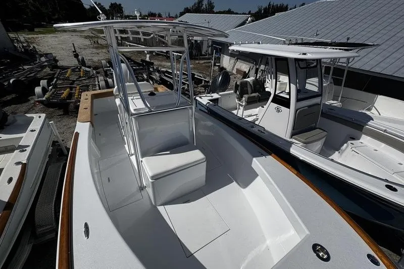 Slide: The Image of 1982 Grady-White Tournament 22 boat with seating and T-top, docked outdoors. - 17