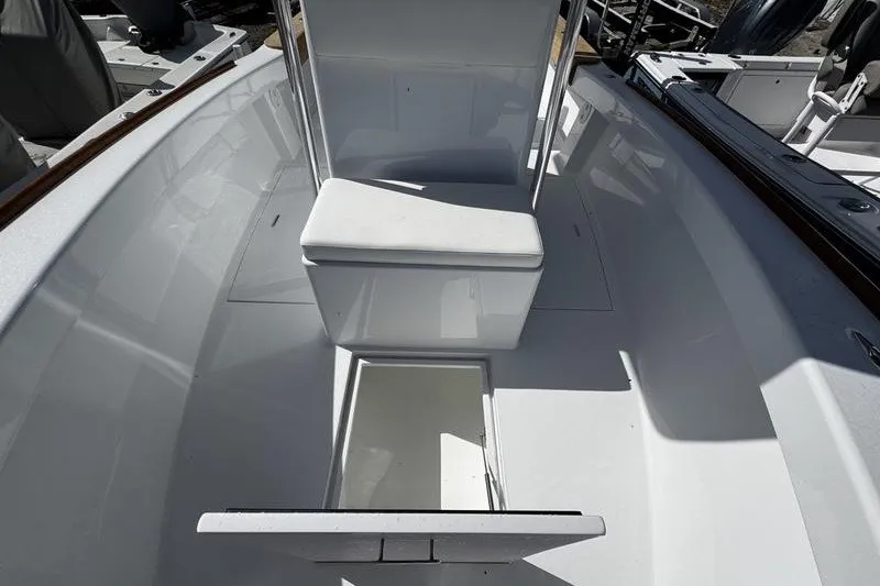 Slide: The Image of 1982 Grady-White Tournament 22 boat interior with seating and storage compartments. - 13