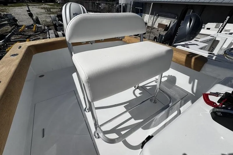 Slide: The Image of 1982 Grady-White Tournament 22 boat with white seating and chrome frame on deck. - 30