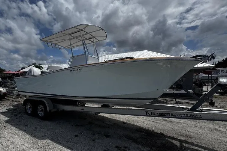 Slide: The Image of 1982 Grady-White Tournament 22 boat on trailer under cloudy sky. - 3