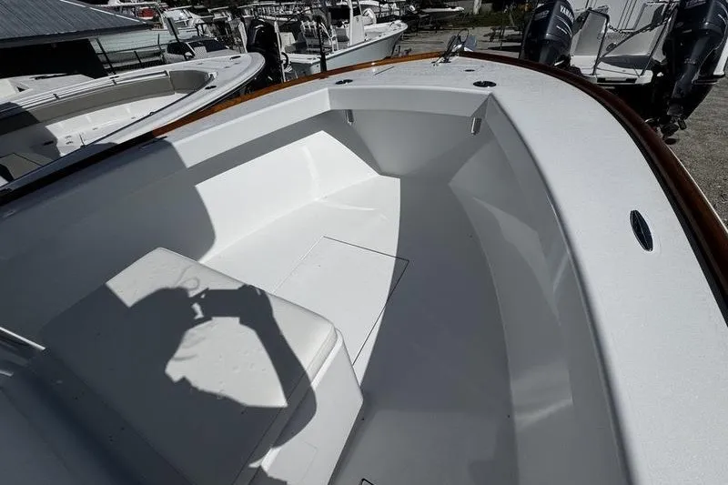 Slide: The Image of 1982 Grady-White Tournament 22 boat interior with seating and clean white finish. - 11