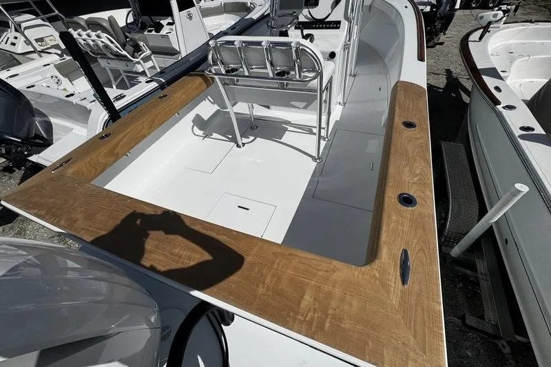 Slide: The Image of 1982 Grady-White Tournament 22 boat with wooden trim and seating, docked outdoors. - 7