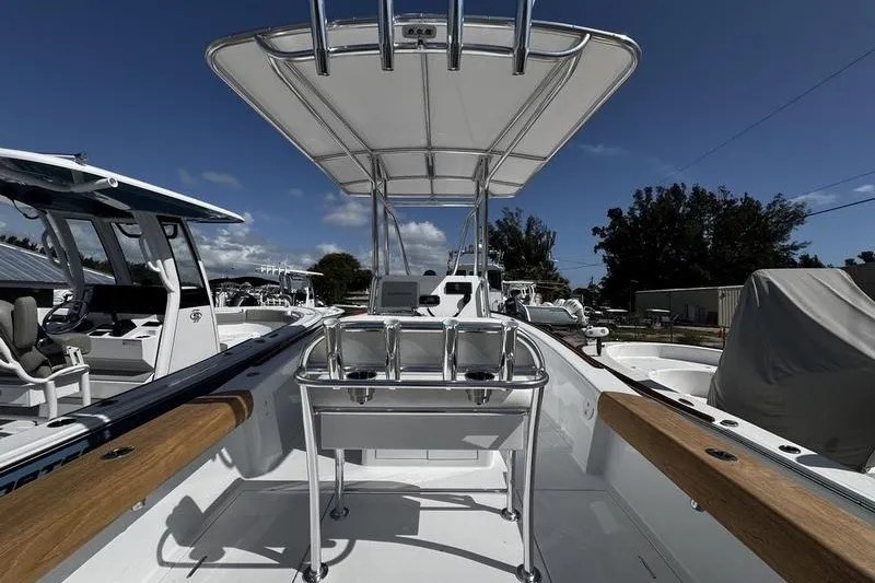 Slide: The Image of 1982 Grady-White Tournament 22 boat with T-top and seating, displayed outdoors. - 10