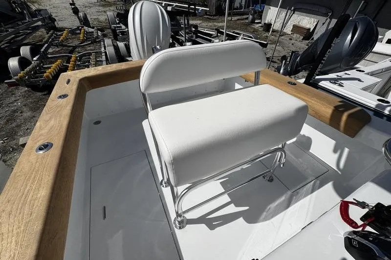 Slide: The Image of 1982 Grady-White Tournament 22 boat interior with white seating and wooden trim. - 29