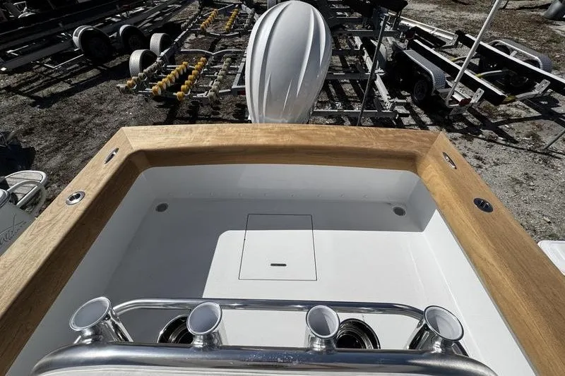 Slide: The Image of 1982 Grady-White Tournament 22 boat interior with wooden trim and rod holders. - 31