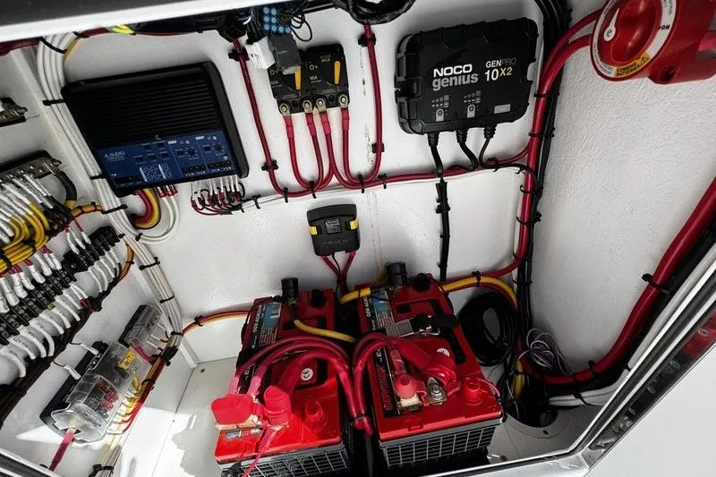 Slide: The Image of Electrical system setup in a 1982 Grady-White Tournament 22 boat, featuring batteries and wiring. - 28