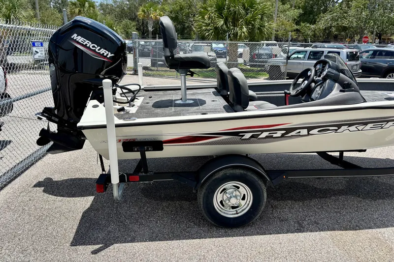 Slide: The Image of 2023 TRACKER MARINE Pro Team 175 TF boat with Mercury engine on trailer. - 5