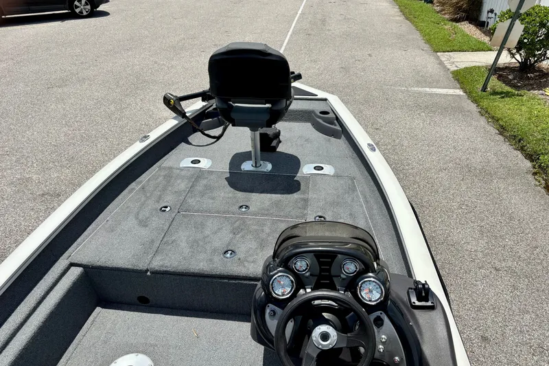 Slide: The Image of 2023 TRACKER MARINE Pro Team 175 TF boat interior with steering console and seating. - 10